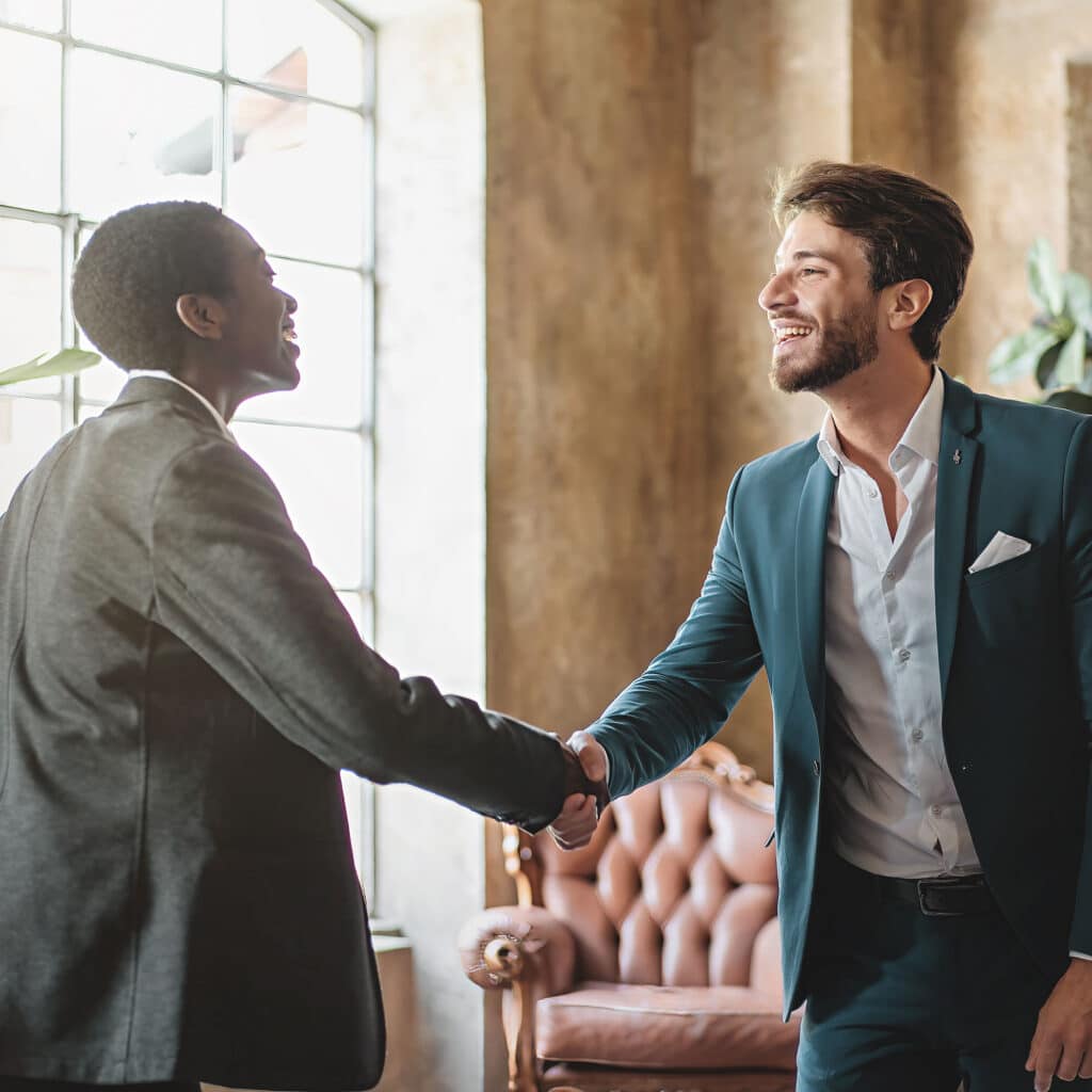 Business handshake in modern office